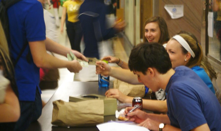 Photo by  ..... | Student council members gather to sell prom tickets during both lunches. 