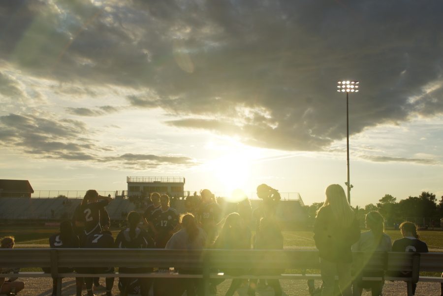 The sunsets over the field during the Varsity Soccer teams regional 1-0 win against Farmington Hills Mercy on Tuesday, June 5.