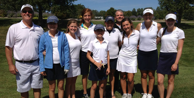 Hannah Buzolits ‘13 | The girls golf team poses for a quick picture in between holes at one of their recent tournaments in Traverse City. The team placed fifth in the event. 