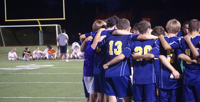 Photo Courtesy of Mikey Sullivan 13 South huddles after thier 1-0 victory at rival Grosse Pointe North Wednesday, September 12.
