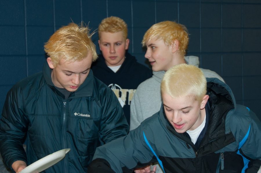 Members of boys swim team bleach hair for upcoming meets 