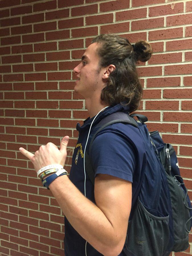 Andrew Trost 16 shows off his luscious locks.
