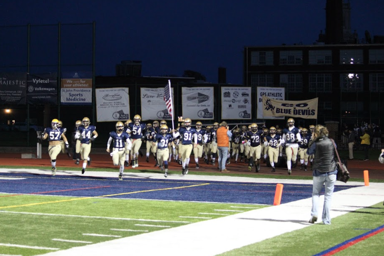 The Blue Devils enter the field. Photo by Jack Roma 17.