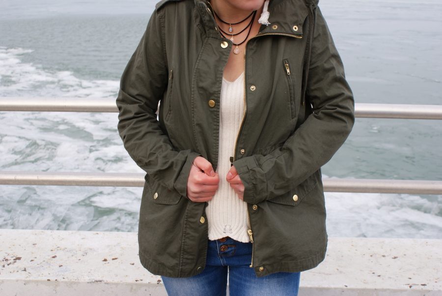 Caroline Baratta 19 models a bomber jacket at the Grosse Pointe Pier Park.
