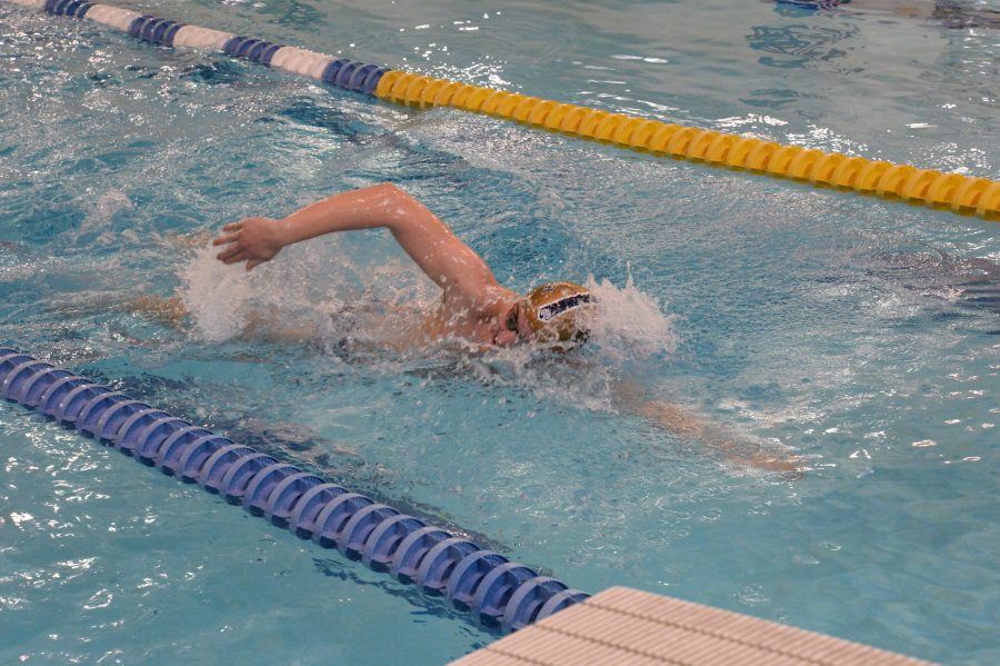 Boys varsity swimming team participates in college level scrimmage