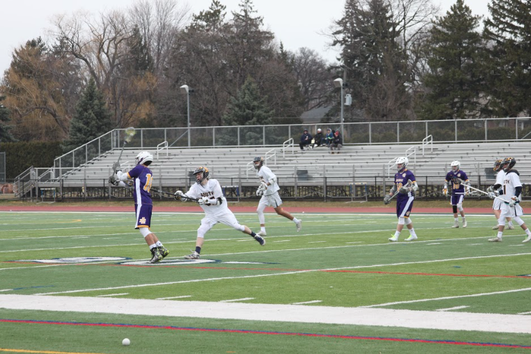 The boys varsity lacrosse team fell 15-1 to Catholic Central in their first game of the season. Photo by Alyssa Czech 19.