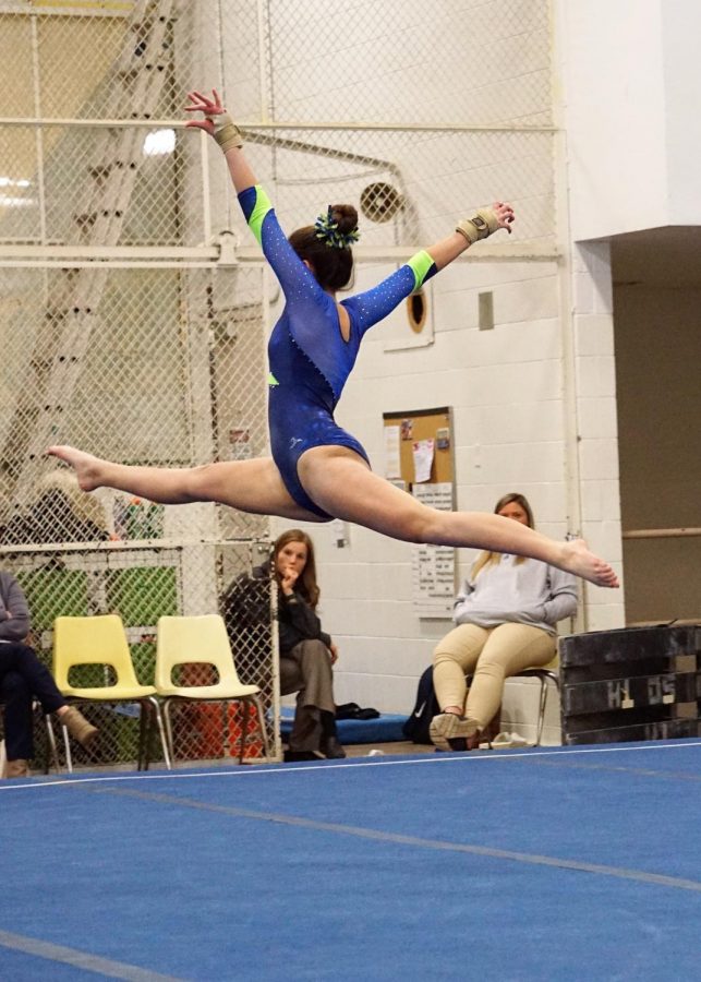 Kate Ennis 21 has been doing gymnastics for six years. Photo by Hope Whitney 21.