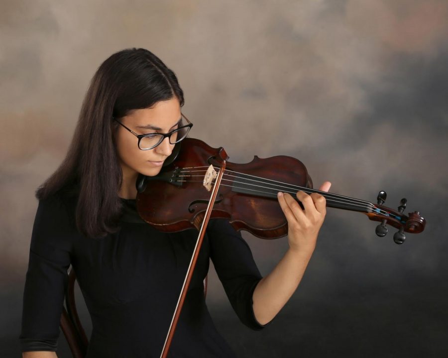 Anna Jarboe 19 practices her violin. She heads to the Peabody Institute at Johns Hopkins University to study violin performance this Fall. Photo courtesy of Jarboe.