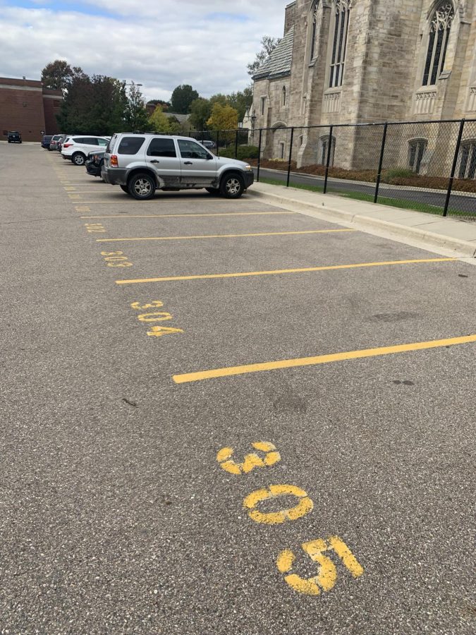 Parking spots remain empty in the S-lot during school. According to parking adviser Heidi Hannan, additional S-lot passes have been given out since the start of the school year. Photo by Anthony Furtaw 21.