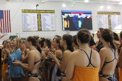 The team meets and cheers before their meet on Sept. 11. Photo by Keely Messacar 21.