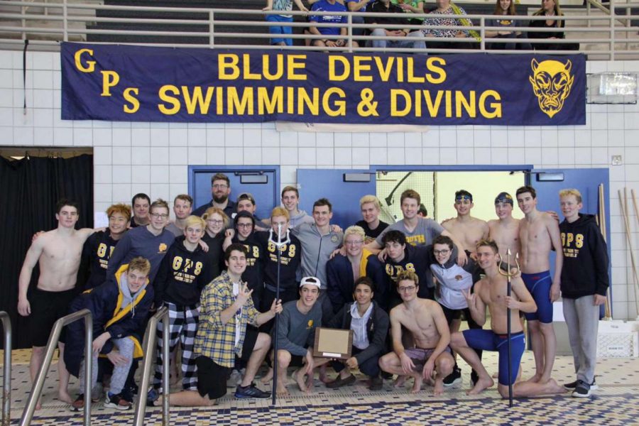 Boys swim and dive team celebrating their greats wins from the MAC meet.