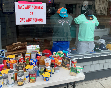 ALL IN THIS TOGETHER: The Campus Shop in The Village has collected food items for those in need. Grosse Pointers are
welcomed to leave their excess food or pick up anything theyve been looking for.
