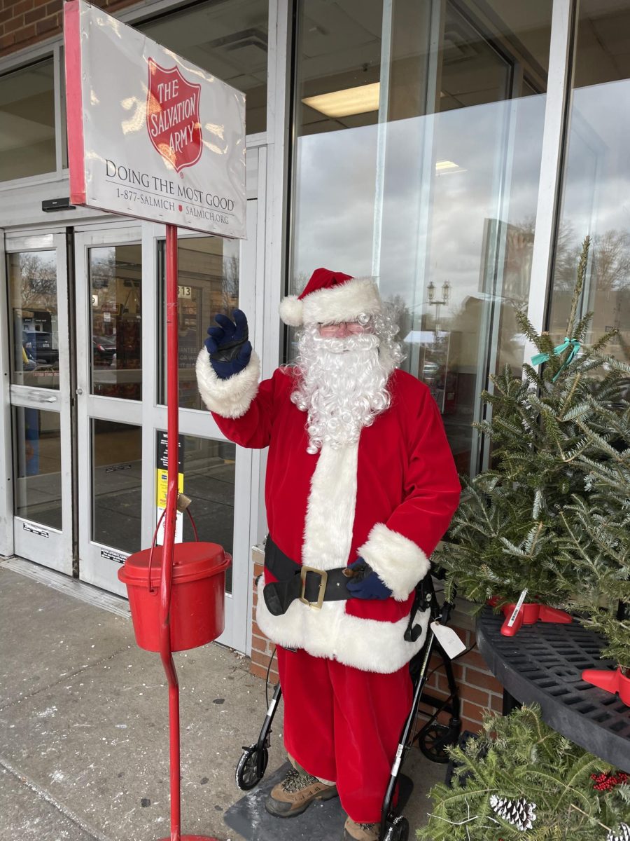 Jerry Stewart poses in front of Kroger ringing his bell for donations on January 12th.