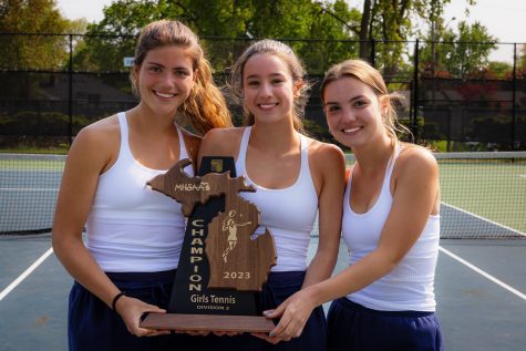 Captains pose with the trophy. From left to right Maeve Hix ’24, Anamaria Garberding ’23, Megan Kornmeier ’23. All captains and their doubles partners left the regional undefeated. Garberding and Hix won 6-0 against both Ferndale and Grosse Pointe North. Kornmeier and her partner Kaitlyn Strong ’26 dominated their opponents Berkeley and Ferndale.