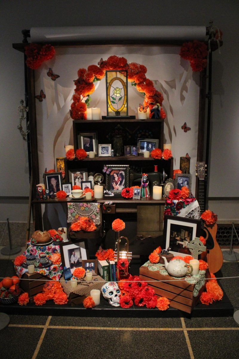 TRADITION IN ACTION While many ofrendas at the exhibit portrayed modern interpretations, this ofrenda harkened back to the traditional three-tiered version. 