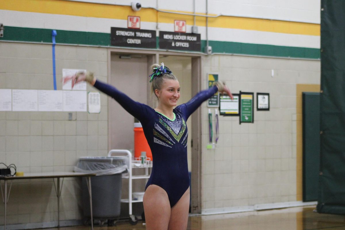 SMILING FOR THE CAMERA Allison Mattes ’25 (GPN) prior to performing her vault routine.
