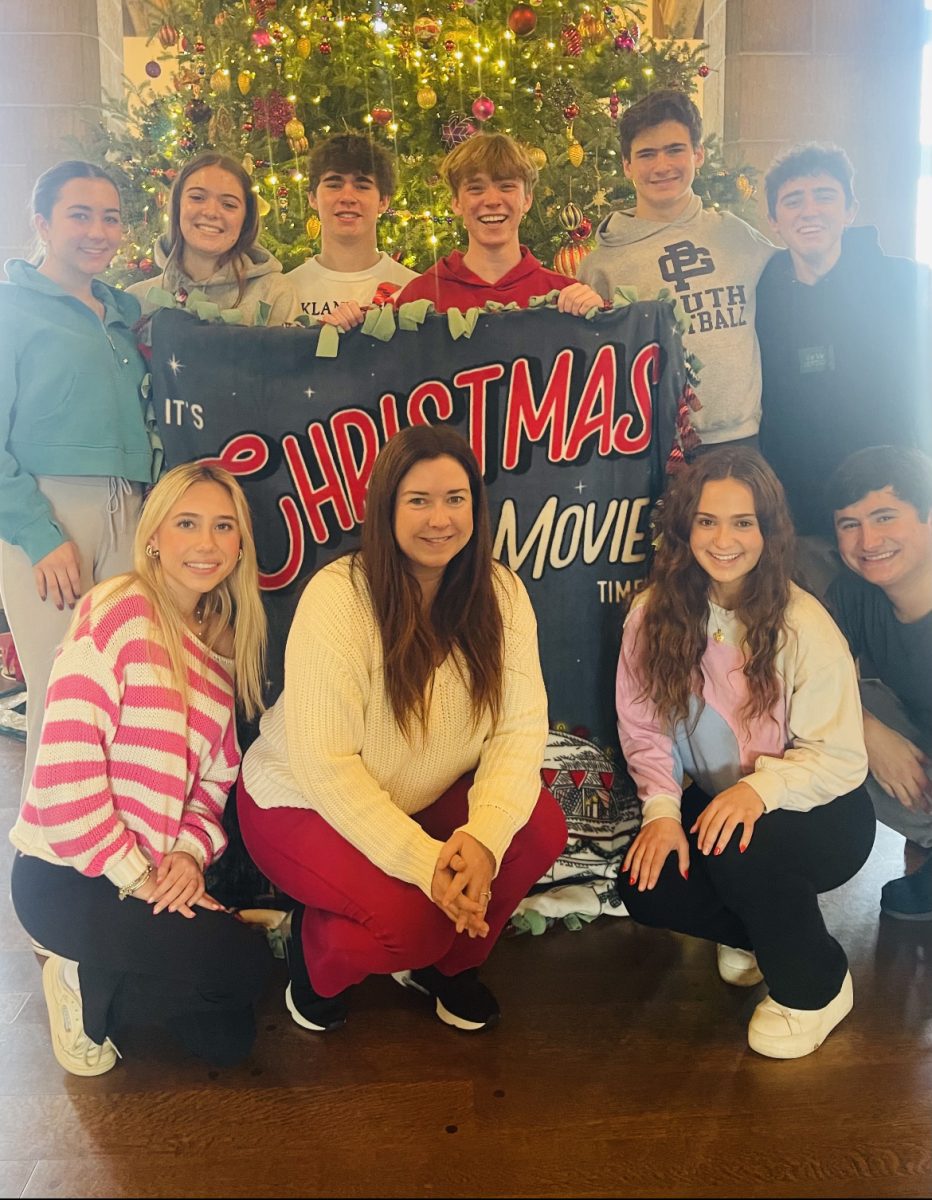 Charlotte Bedsworth, Lily Petz, Joey Michelotti, Patrick Messacar, James Michelotti, and Micheal Kornmeier. Bottom: Grace Curtis, Nancy Cotton, Ella Telegadas and Tommy Ciconte. The senior student council and leader of Blanketed with Love holding up their finished Christmas blanket at the Country Club of Detroit.