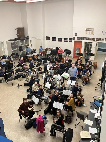 The Grosse Pointe South Full Orchestra rehearses the fourth movement of Jean Sibelius’s Symphony No. 2 in D Major in preparation for their spring concert and senior showcases on May 21. 