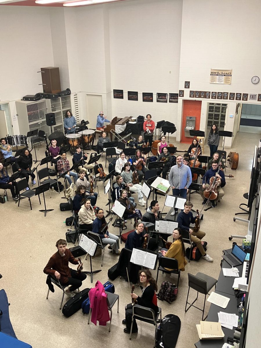 The Grosse Pointe South Full Orchestra rehearses the fourth movement of Jean Sibelius’s Symphony No. 2 in D Major in preparation for their spring concert and senior showcases on May 21. 