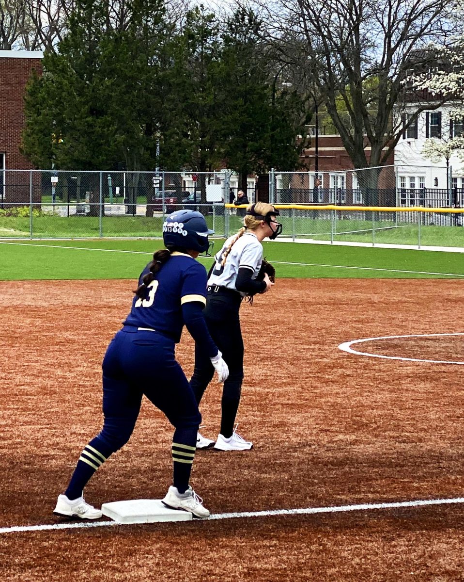   Mackenzie Simon ’26 stands at third base in the top of the first inning. She goes on to score in part of a nine-run inning.
