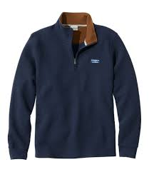 Quarter zips can almost be classified as a sweatshirt, but they differ greatly in looks. With a zipper only partly down the front, they allow the wearer’s neck to breathe and cool off. They can come in fun colors and be fuzzy or knitted. 
