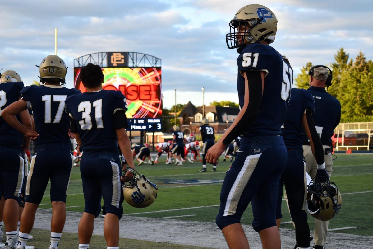 Griffin Szatkiewski ’25 looks on as South inches closer to the end zone.