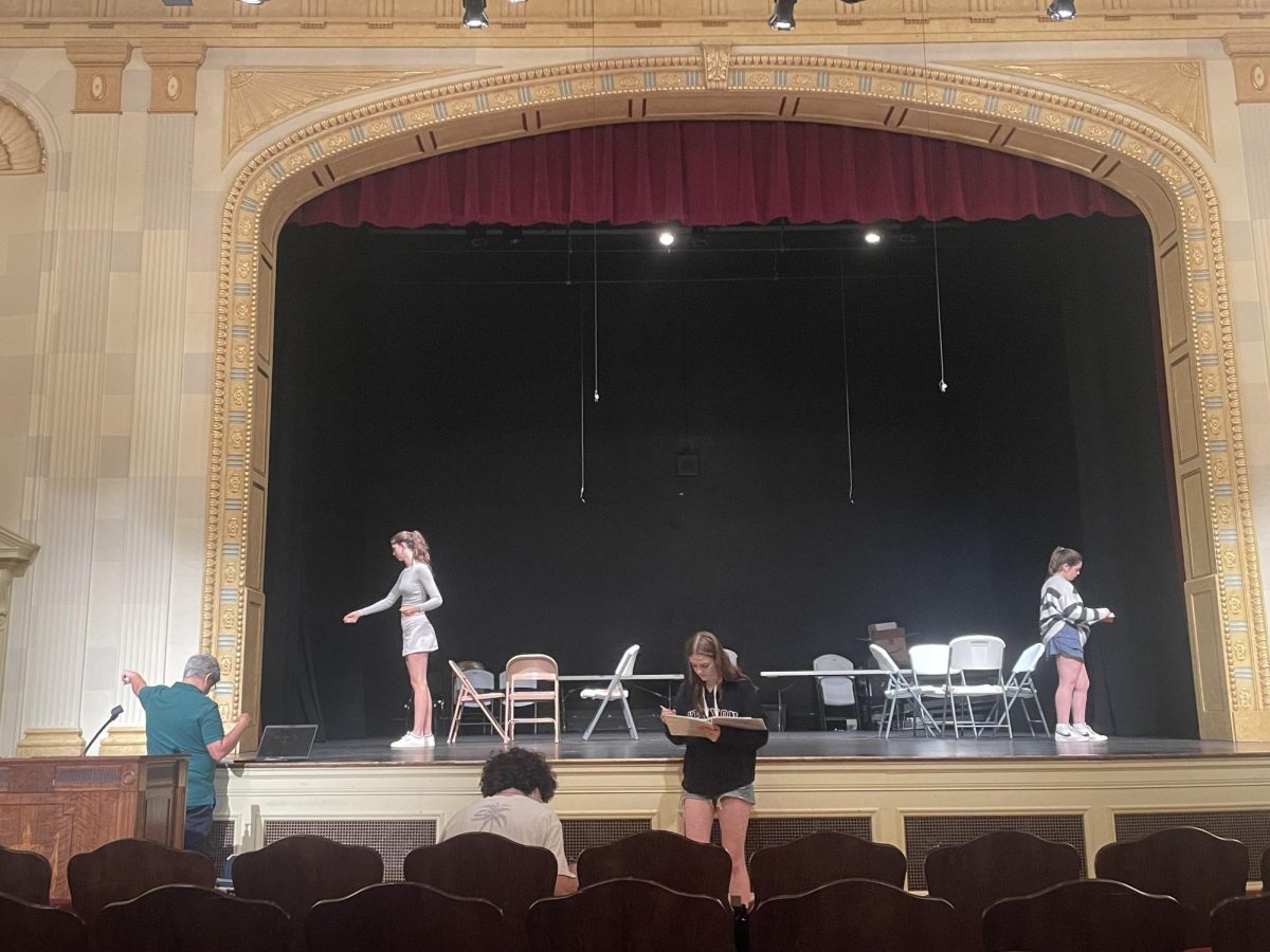 Ellie Sahutske ’26 and other cast mates, Jolina Hutchinson ’25, Allie Thomas ’25, and Zach Neme ’26 take notes from director Dan DeMarco during rehearsal for South’s fall play, Our Town.