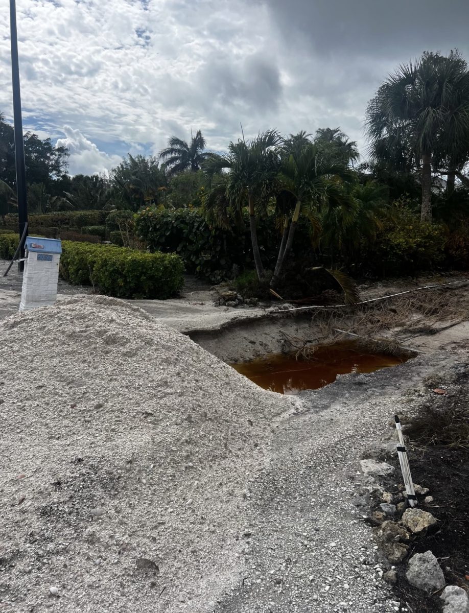 Rick and Cindi Portwood's driveway in Long Boat, Key Florida after Hurricane Milton and Helene. There is a giant sinkhole the size of a truck left after the storm, but you can see that their mailbox next to it survived. (Courtesy of Cindi Portwood)