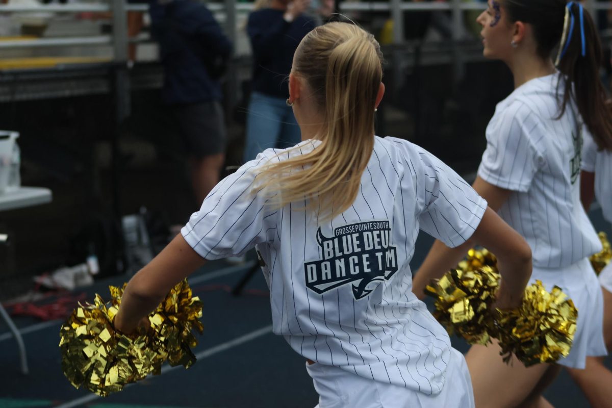 Natalie Vassel ’26 grooves to the music during a break in the game.