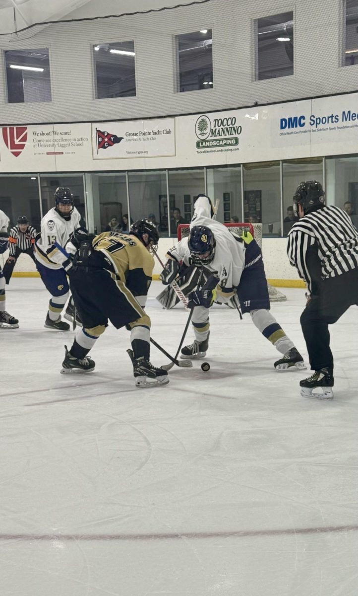 Charlie Winkler ’27 faces off during the first period in South’s defensive zone, winning it back to the defensemen for a strong breakout through the neutral zone.