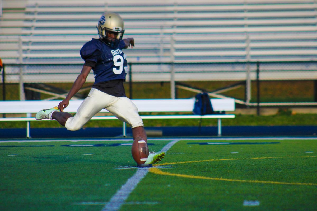 Grosse Pointe South Kicker Onction Zape ’25 practicing his kicks for special teams. Like most kickers in college and the NFL, Onction started out as a soccer player that moved to football.