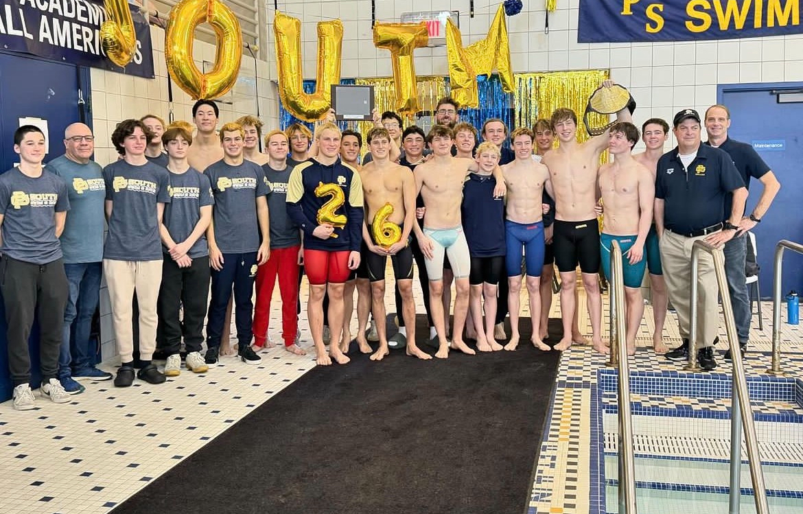 Souths swim team stands on the deck as they win the MAC meet, working hard over break.