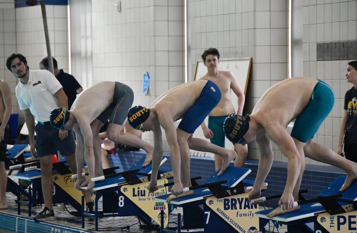 Swimmers are on the block as they prepare to dive in. (Photo Courtesy of Jessica Bryan).