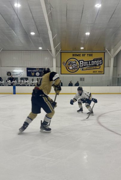 Marty Wayman ’28 defends against L’Anse Creuse center, angling the player away from South’s goalie, allowing for another strong breakout for the Blue Devils.