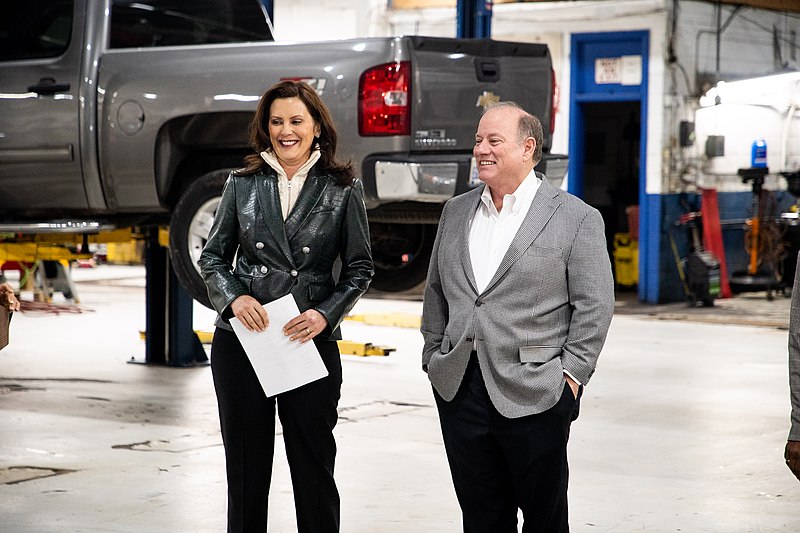 Mayor Mike Duggan of Detroit speaking with Governor Gretchen Whitmer. Duggan is seeking Whitmer’s position as she has reached Michigan’s governor term limit of two.