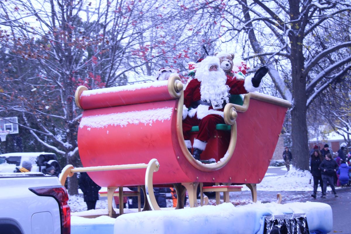 The infamous Santa in Grosse Pointe’s red sleigh being pulled in the parade.