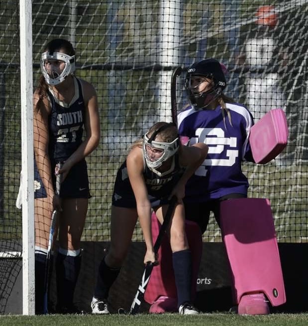 Lucy Tull ’25 (left) and her teammates performing a defensive corner during a tight scoring game. (Photo courtesy of Leon Halip).