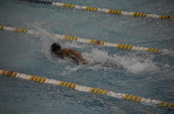 Nadeem Haurani ’27, is laser-focused as he races to a 2nd place finish in the home stretch of the 200 Freestyle.