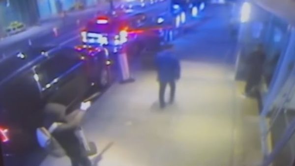 Surveillance video shooting shows Thompson walking down the street as an armed gunman wielding a suppressed pistol fired three shots to his back.