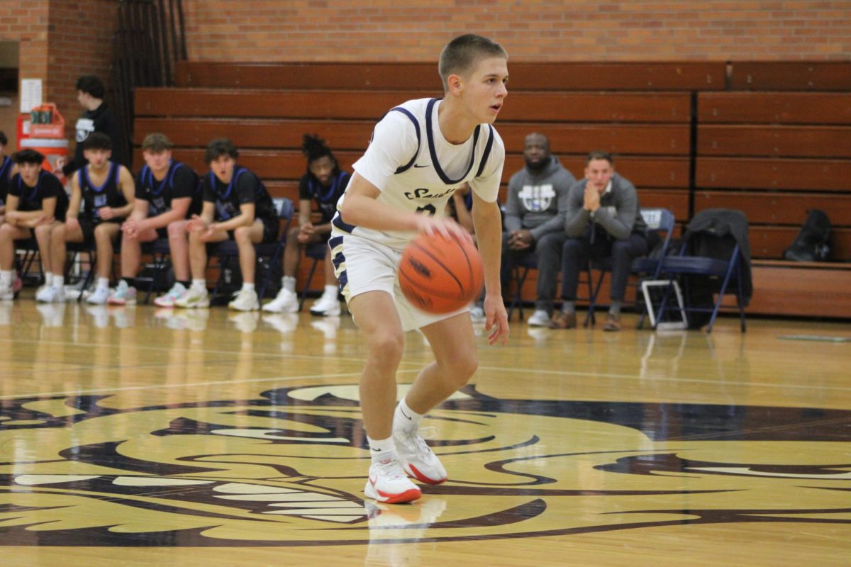 Kooper Richards ’26 dribbling the ball to the offense trying to disturb their press defense.