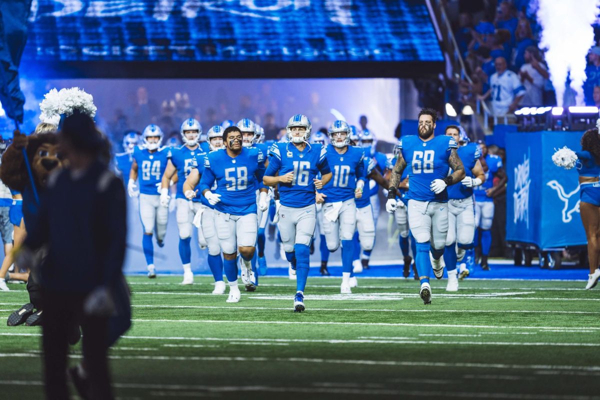 Jared Goff leading the Lions onto the field in a crucial game.