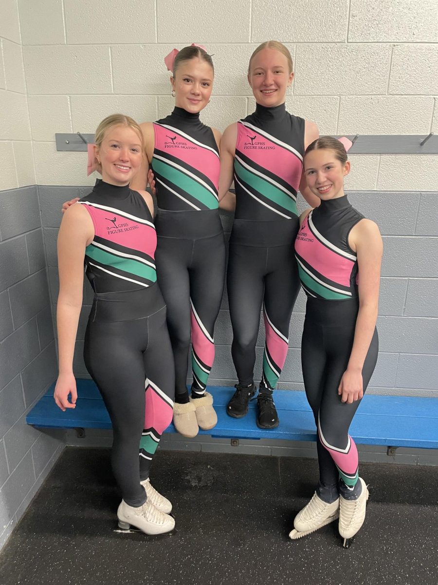 Smiling proudly after their meet on January 9th, the Grosse Pointe unified figure skating team is set in third place in their division, and qualified for states.

From left to right, Helena Moore ‘25, Abby Owczarek ‘26, Claire Wengal ‘26, Remy Henry ‘25 .
