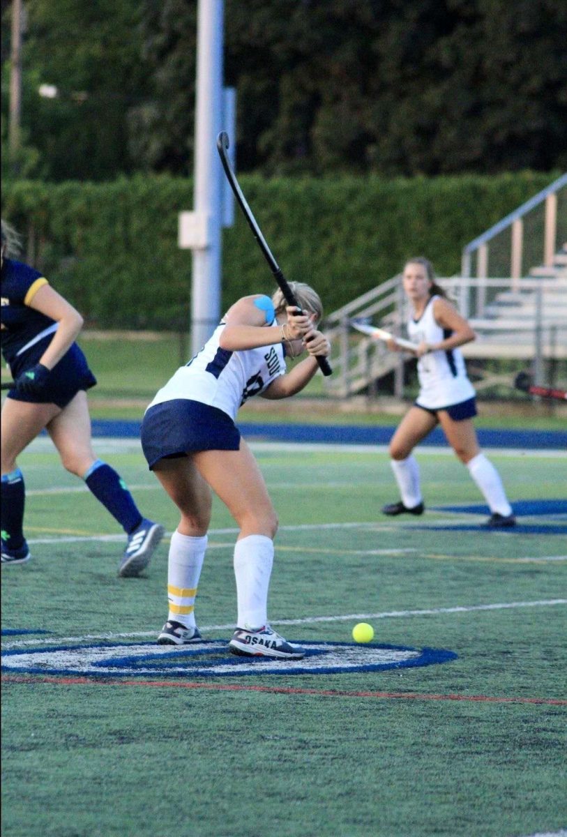 Scout Webber '25 loads up to strike the ball. Photo courtesy of Hannah Agnone.