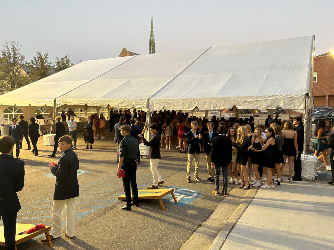 Past South Homecoming dance (2023): Hoco dance attendants gather in the S-lot to spend time together, and participate in fun activities, such as cornhole. A large tent is provided for students to dance under. (Photo courtesy of Elle Petz ’26)
