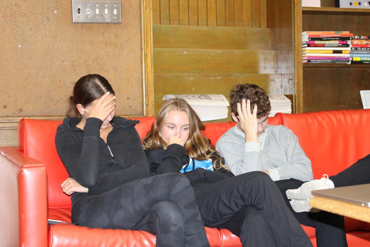 Trapped within boredom: Morgan Costello ’27, Annie Paradise ’27 and Gus Nutter ’27 are downhearted during the school day at South, due to the absence of Halloween activities available for the upcoming weekend.  