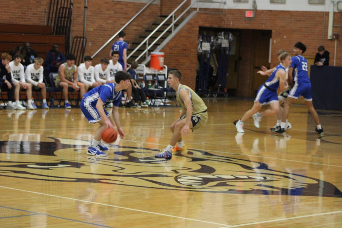 Kooper Richards ’27 defends his opponent, demonstrating aggression and competitiveness. 
