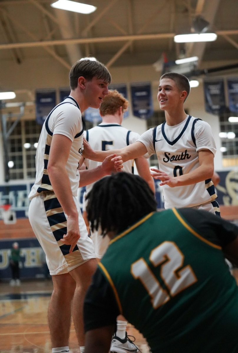 Kooper Richards ’27 and Nolan Gross ’27 celebrate after scoring a basket against North. 
Photo courtesy: Kooper Richards