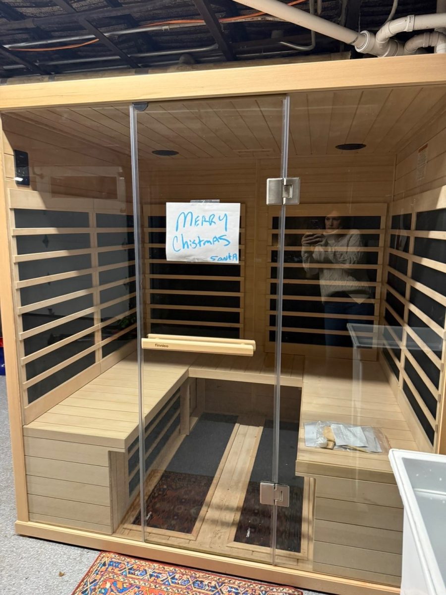 Gift reveal: Malone Sullivan ’27 receives a new surprise sauna on Christmas morning as she walks into her garage. 