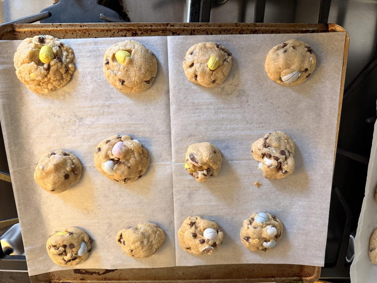 After being taken out of the oven, the Cadbury egg cookies rest on the stove top to finish internally cooking for the next 45 minutes before they are ready to eat.
