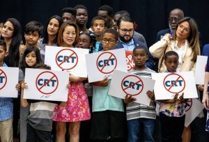  Students at Mater Academy Charter Middle/High School hold signs protesting against “critical race theory” being taught in schools on April 22, 2022, in Hialeah Gardens, Fla. Photo courtesy of Daniel A. Varela/Miami Herald via AP.